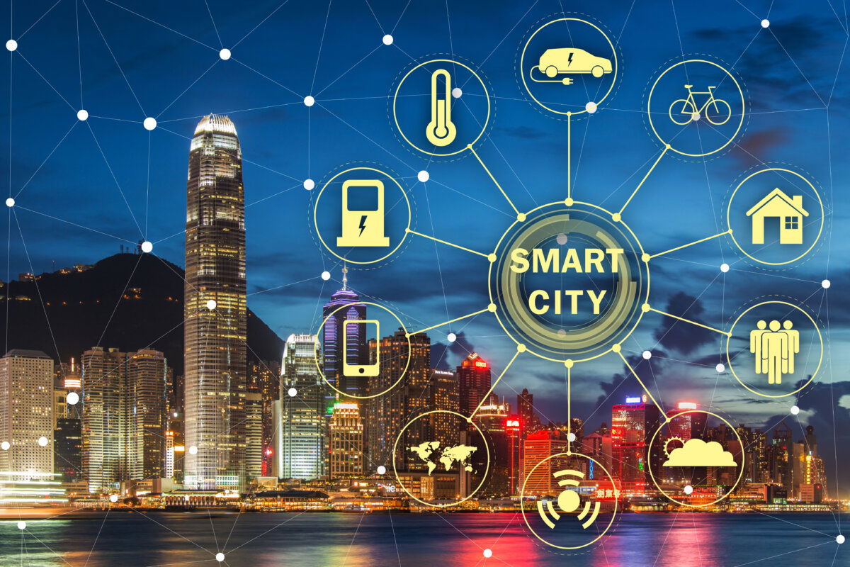 Smart city concept with digital network overlay showing connected urban services such as electric vehicles, smart homes, public infrastructure, and environmental monitoring – illustrating how 5G RedCap supports efficient and scalable IoT connectivity in modern urban environments.